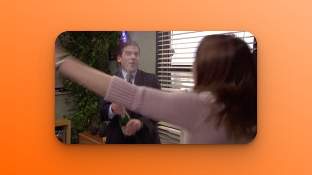 Michael Scott spraying champagne